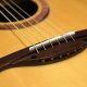 Unveiling the Secrets of Acoustic Guitar Bone Saddles: Discoveries and Insights - Master the Art of Playing Guitar and Play Like a Pro