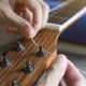 Unveiling the Secrets: The Ultimate Guide to Changing Guitar Strings for Perfect Sound and Playability - Master the Art of Playing Guitar and Play Like a Pro