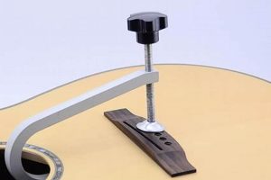 Unlock the Secrets of Acoustic Guitar Bridge Clamps: Unveil Tonal Perfection and Unwavering Stability - Master the Art of Playing Guitar and Play Like a Pro