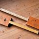 Unveiling the Secrets of Tuning a Three-String Cigar Box Guitar: A Journey to Perfect Harmony - Master the Art of Playing Guitar and Play Like a Pro