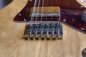 Unveiling the Secrets of Electric Guitar Bridges: A Journey to Tonal Perfection - Master the Art of Playing Guitar and Play Like a Pro