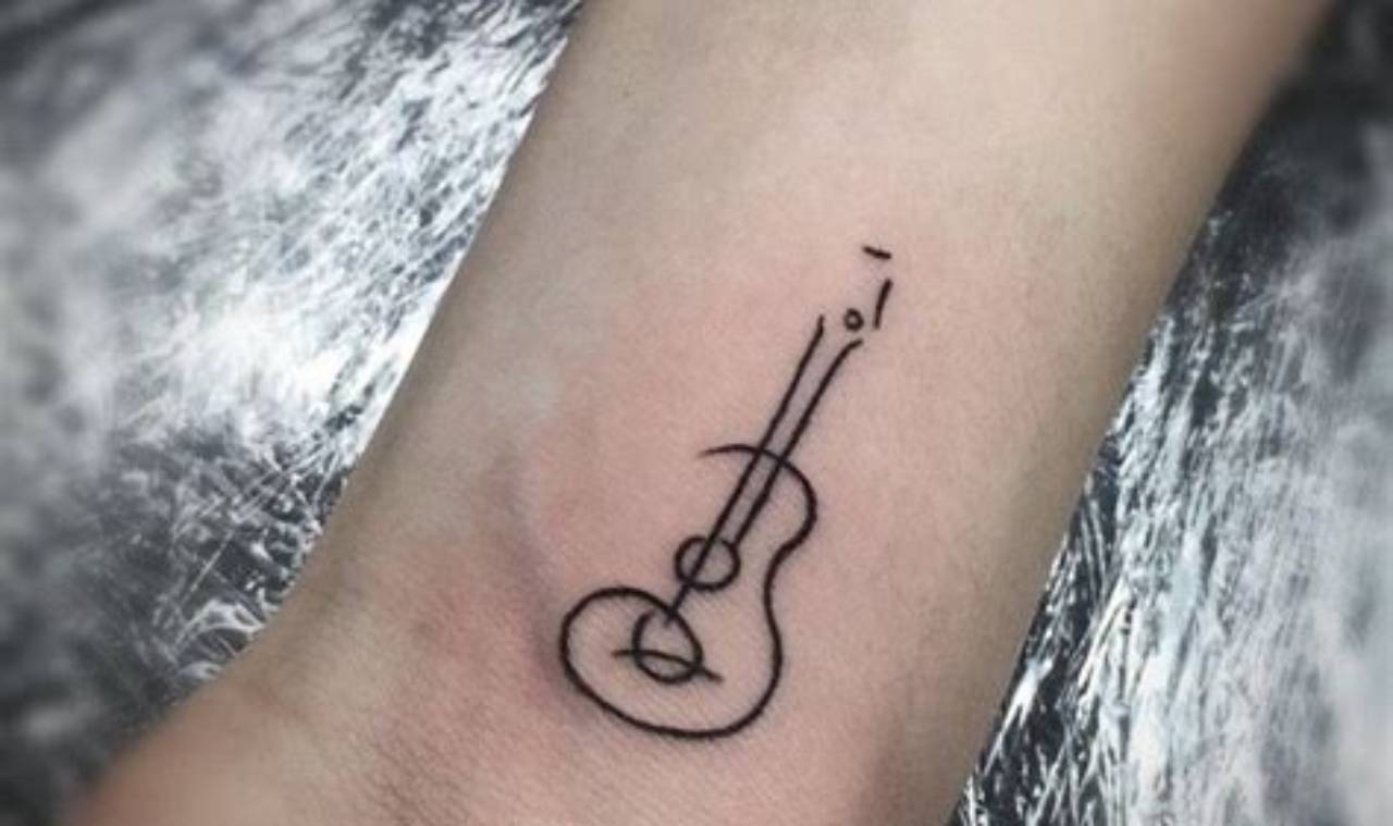 Unveiling the Art of Acoustic Guitar Tattoos: Discover Unique Designs and Meanings - Master the Art of Playing Guitar and Play Like a Pro